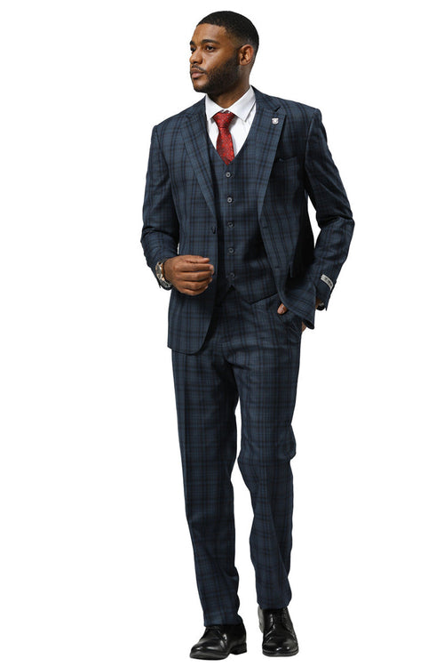 Navy modern fit vested suit by Stacy Adams. Double windowpane plaid, three-piece ensemble: jacket, vest, trousers. Notched lapels, single-breasted, straight leg. Structured fit.