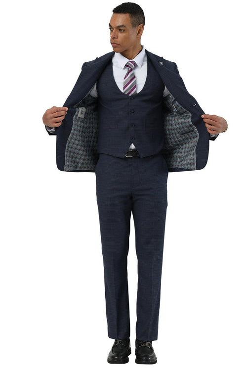 Navy glen plaid two-button suit by Stacy Adams. Peak lapels, open jacket with lined interior. Includes a matching scoop vest and tailored trousers for a structured fit.