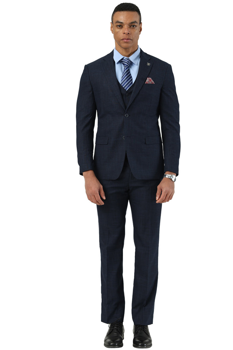 Navy blue sharkskin Stacy Adams men's vested suit. Fitted silhouette, notch lapel, three-button closure. Includes vest, white shirt, striped tie, straight-leg trousers, and black dress shoes. Subtle textured fabric.