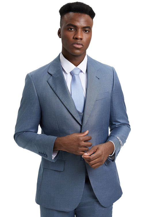 Stacy Adams men's steel light blue sharkskin suit. Two-button jacket with notched lapels and subtle sheen. Includes vest, maintaining color scheme. Paired with light blue tie and white shirt, offering a sharp, tailored silhouette.