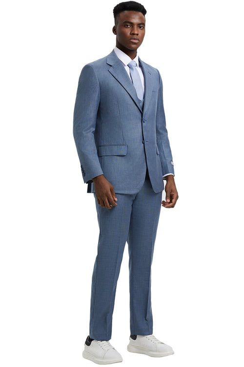 Stacy Adams men's sharkskin suit in steel light blue. Two-button blazer with notch lapel and pockets. Three-piece design with matching straight-leg trousers. Tailored silhouette, smooth fabric, subtle sheen.