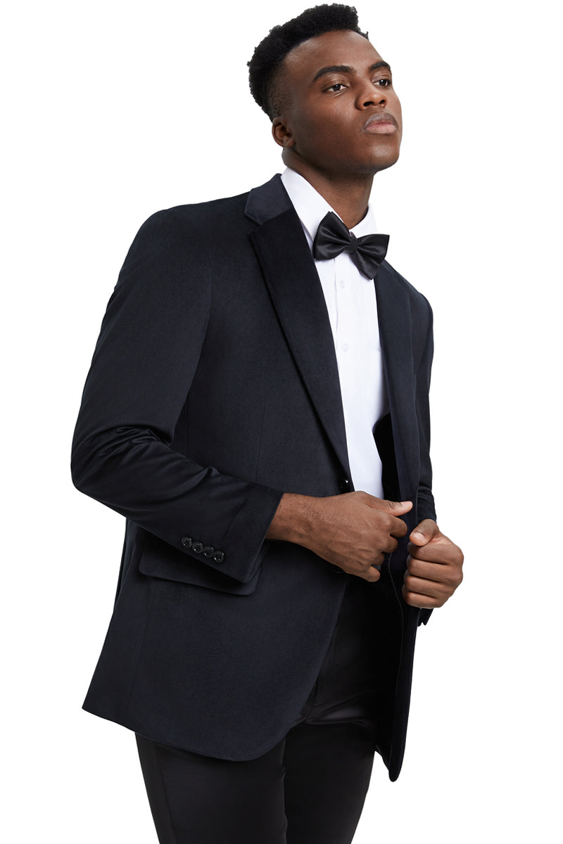 The men's Stacy Adams modern fit velvet blazer is black with a smooth, plush texture. It features a single-breasted design and a notch lapel. The sleeves have button details.