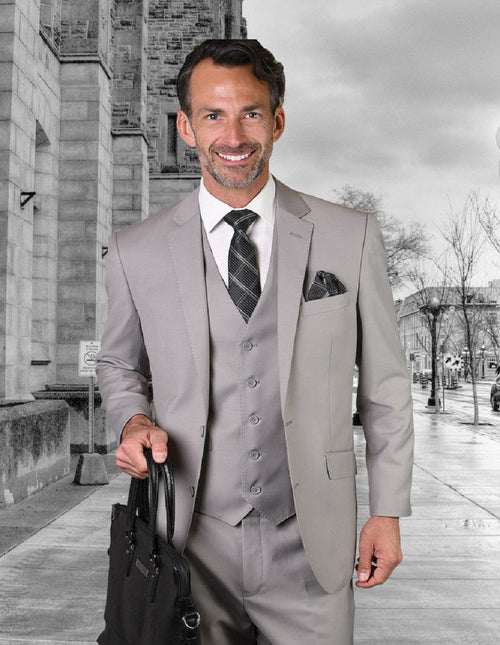 Men's modern fit, 2-button vested wool suit in platinum. Light gray, tailored silhouette with a smooth, structured fabric. Includes jacket, vest, trousers & pocket square. Sleek & sophisticated.