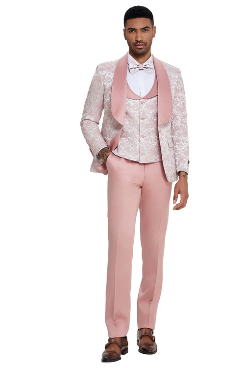 Men's pink designer tuxedo. Shawl lapel, vested, and paisley pattern. Structured fit with single-button jacket and tailored trousers. Glossy finish. Perfect for weddings & proms.
