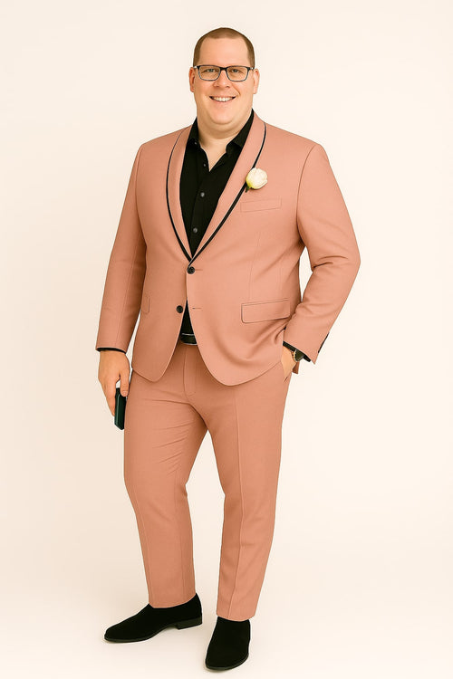 Men's slim fit pink tuxedo suit: fitted silhouette with pink coat & pants. Black shawl lapel & pocket trim. Perfect for formal events.