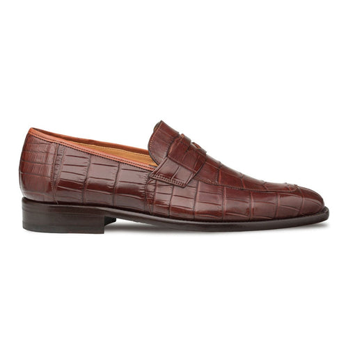 Men's brown alligator penny loafers with a tapered shape and textured finish. Crafted from glossy American alligator skin, they feature a raised instep band, flat heel, and contrasting tan lining.