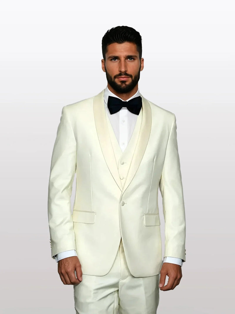 Beige wool tuxedo featuring a white satin lapel and a five-button vest. It includes front pockets and is tailored for a fitted silhouette.