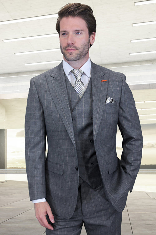 Men's designer suit with grey windowpane plaid. Includes a one-button peak lapel jacket, matching vest (3-button), and tailored trousers. Formal, structured silhouette.