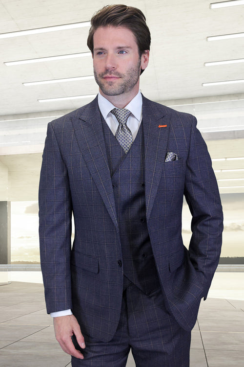 Indigo blue men's wool suit with peak lapels, windowpane plaid. Includes vest and trousers. Tailored fit, structured silhouette, smooth textured fabric. Classic, contemporary design.