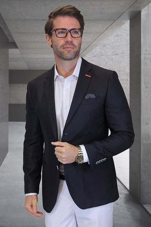 Men's modern-fit wool summer blazer. Black windowpane check, structured silhouette. Single-breasted, patch pocket, matching cuff buttons. Smooth wool texture. Dark pattern on a lighter background. Tailored design.