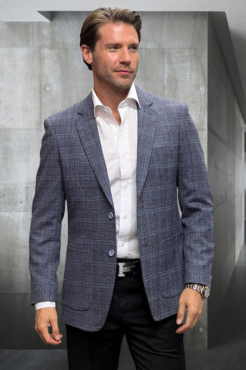 Modern fit men's sport coat in blue windowpane plaid. Crafted from wool-cashmere blend. Features patch pockets, single-breasted, two-button front, and notched lapels. Subtle blue and gray hues.