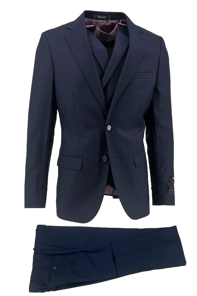 Tiglio Italian suit: dark navy jacket & trousers. Two-button closure, notch lapel, front pockets. Straight-leg, flat-front trousers. Burgundy lining inside jacket. Classic & elegant.