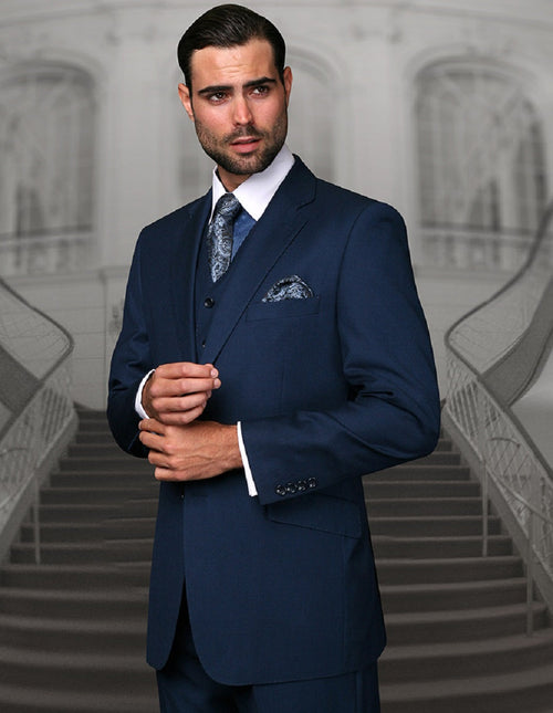 Men's classic fit indigo blue wool suit. Features a 2-button jacket with notch lapels and long sleeves. Pleated pants offer a tailored, formal silhouette.