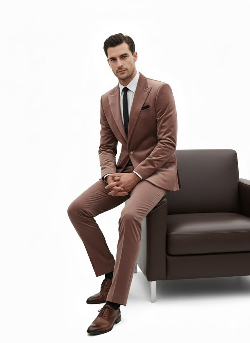 Men's mauve velvet suit: ultra slim fit blazer & pants. Light brown velvet, notch lapel. Includes black pocket square. Styled with dark brown dress shoes for a sleek, sophisticated look.