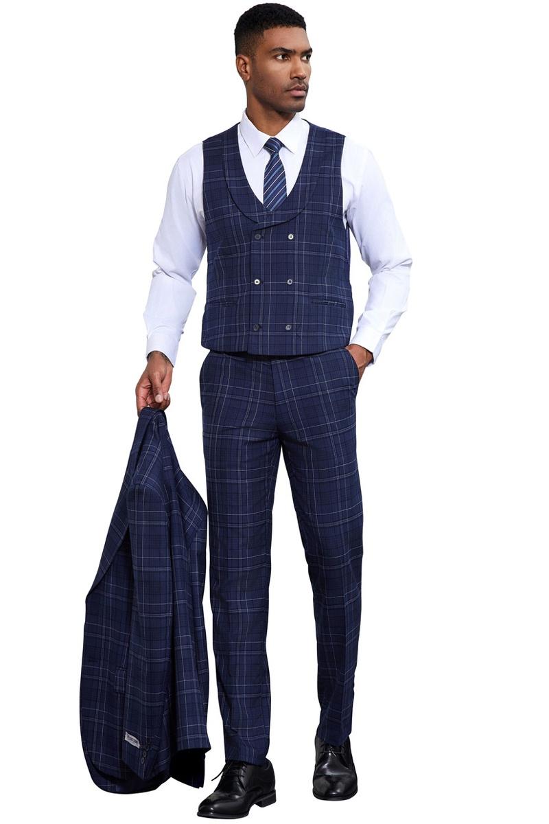 Navy Stacy Adams two-button suit with a fitted vest. Double windowpane plaid pattern. Slim-fit pants and a matching blazer. Vest features a double-breasted design and rounded neckline. Visual consistency throughout the outfit.