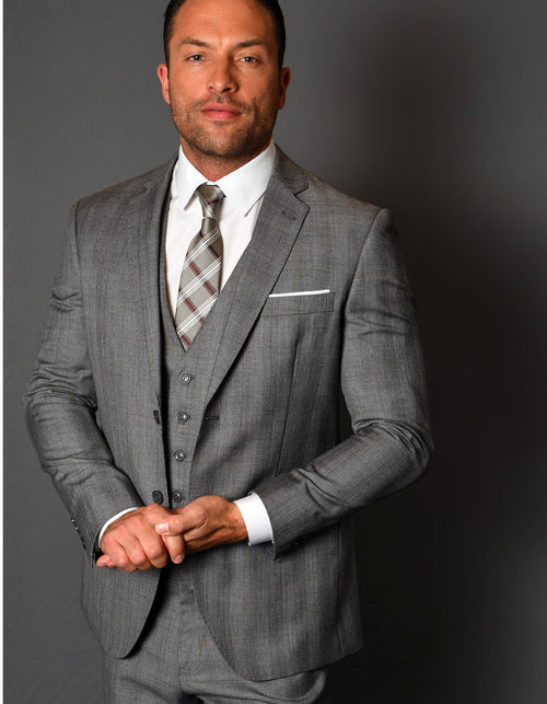 Modern fit grey plaid wool suit for men. Two-button jacket, vest included. Tailored silhouette, notch lapel, smooth texture, and front pockets. Well-fitted design.