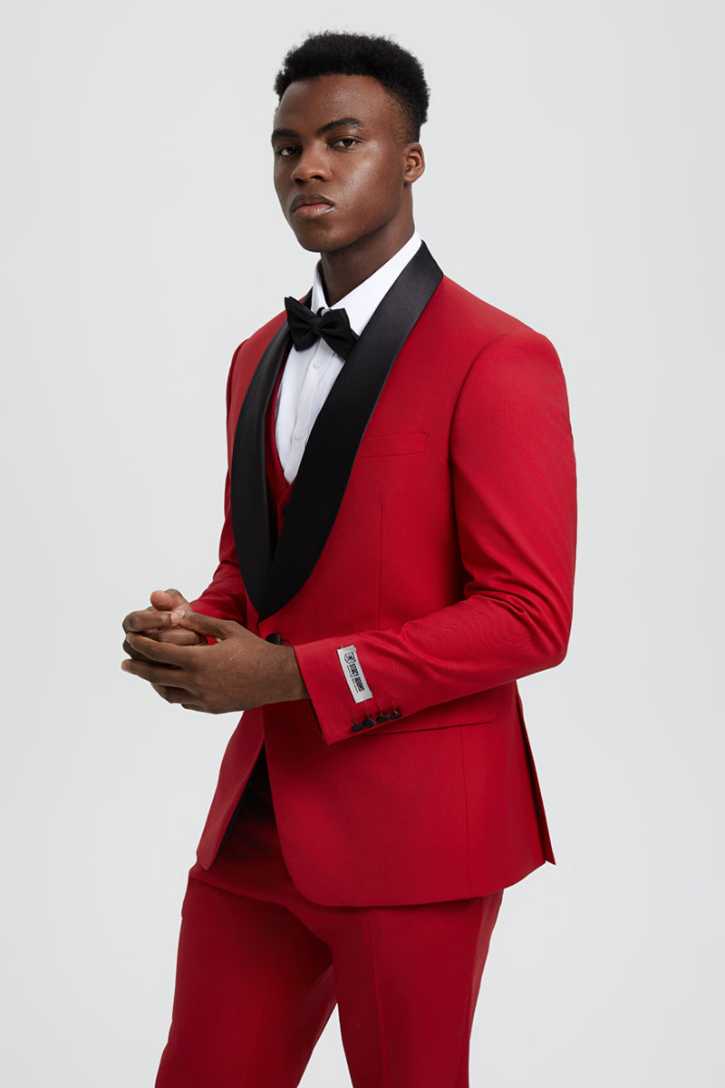 Red Stacy Adams one-button tuxedo with black shawl lapel. Features a single breast pocket and buttoned sleeves. Fitted silhouette with matching red pants. A stylish designer look.