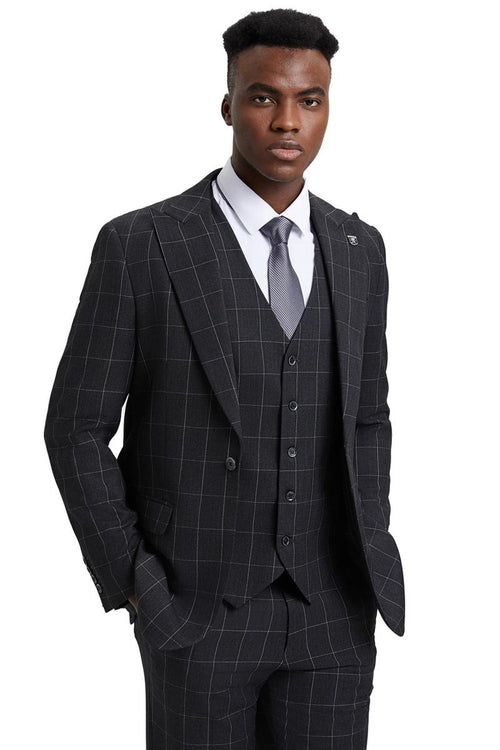The men's Stacy Adams vest features a classic cut with a bold windowpane pattern in dark charcoal grey. The fabric appears to be a suit material, and the vest has a five-button closure and notch lapels.