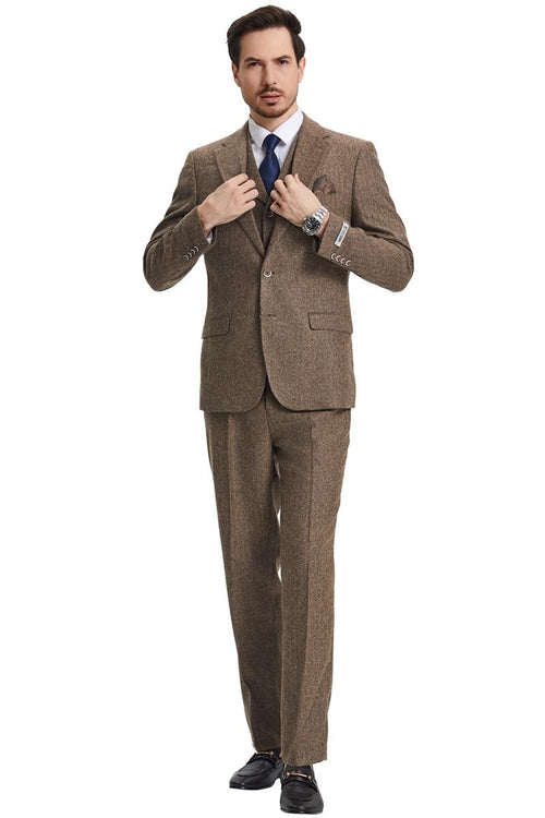 Men's light brown Stacy Adams vintage tweed suit. Herringbone pattern, structured blazer with notch lapels, single-button closure, and vested interior. Straight-cut trousers. Textured fabric for vintage look.