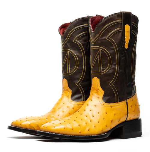 Yellow ostrich quill cowboy boots by Marco Di Milano. Square toe, textured upper with dark brown detailing. Intricate stitching on shaft, red interior lining. Robust heel.