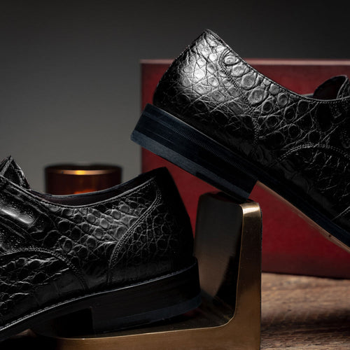 Mezlan Anderson black derby shoes. Crocodile-textured leather, rounded toe, and flat sole. Subtle stitching detail. A stylish, sturdy choice.