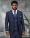 The Statement mens 3 piece big and tall suit features a dark plaid pattern with shades of gray and navy. It consists of a tailored jacket with a notched lapel, a double-breasted vest with four buttons, and matching trousers. The fabric appears to be a blend suitable for formal wear.