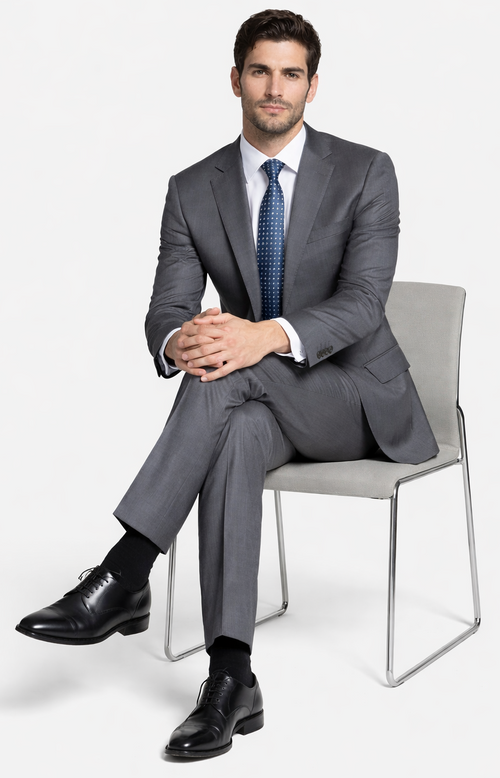 Bertolini gray wool/silk suit (2-button, tailored fit) with structured shoulders. Includes a white dress shirt, blue polka-dot tie, and black dress shoes.