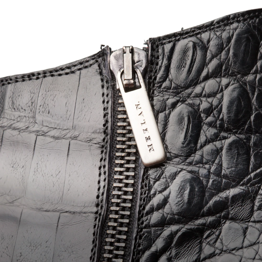 Black Mezlan Blackmore dress boots: sleek black leather with crocodile skin texture. Side silver zipper closure. Visible stitching adds detail.