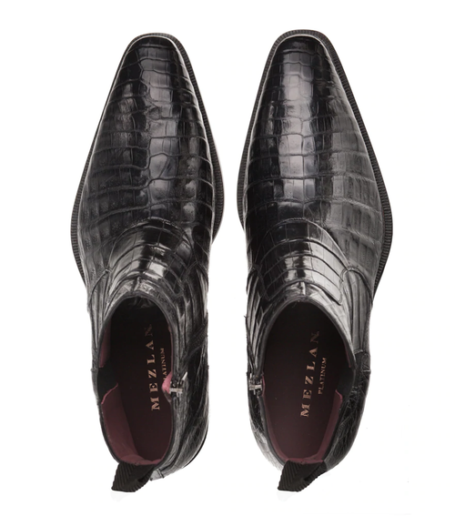 Black Mezlan Blackmore dress boots: crocodile leather, pointed toe, side zip. Glossy texture, burgundy interior, pull tab. Flat, textured sole. Sleek silhouette.