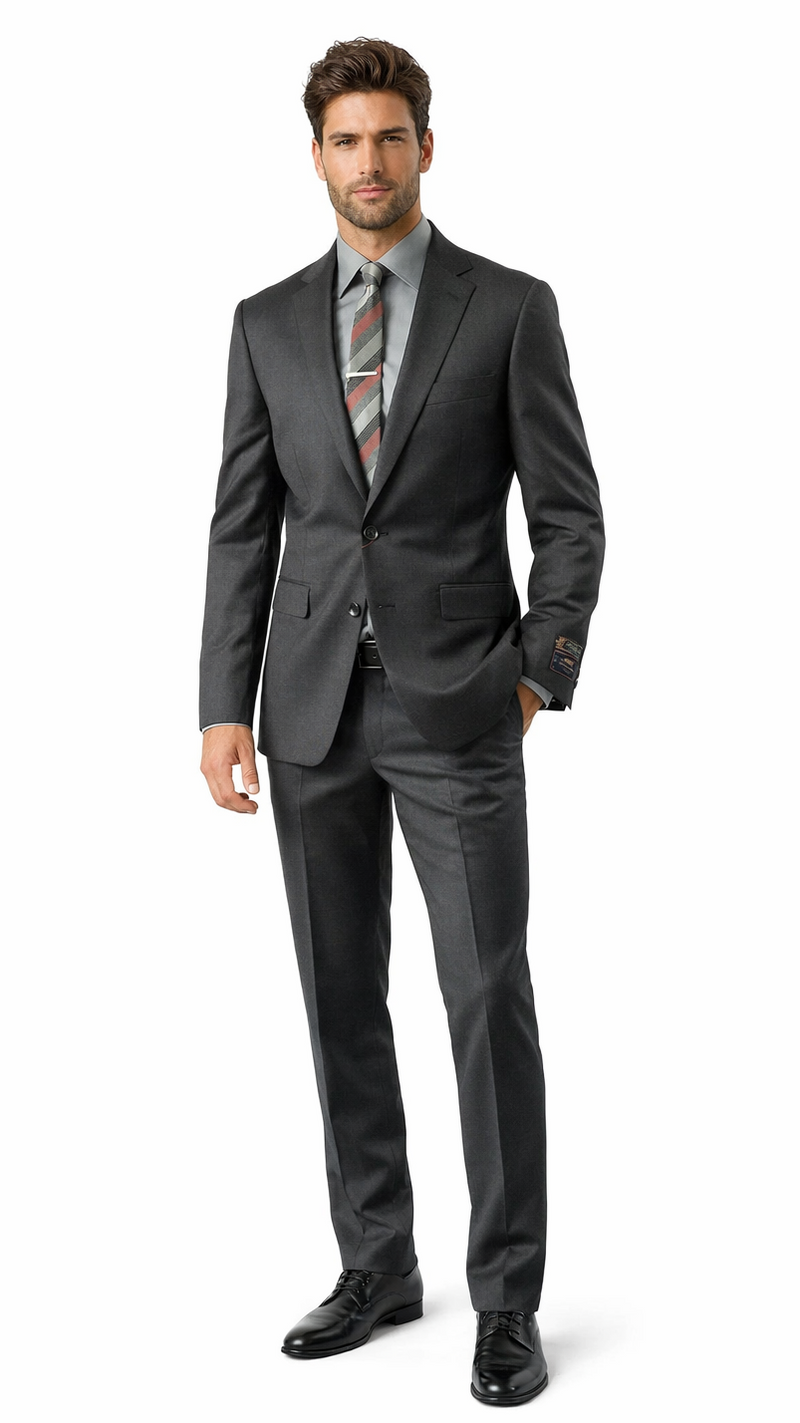 Carlo Lusso charcoal suit by Albertonardoni. Slim fit, tailored silhouette with a poly blend. Features two buttons, notched lapels, and side pockets. Trousers are slim fit with a smooth, charcoal texture.