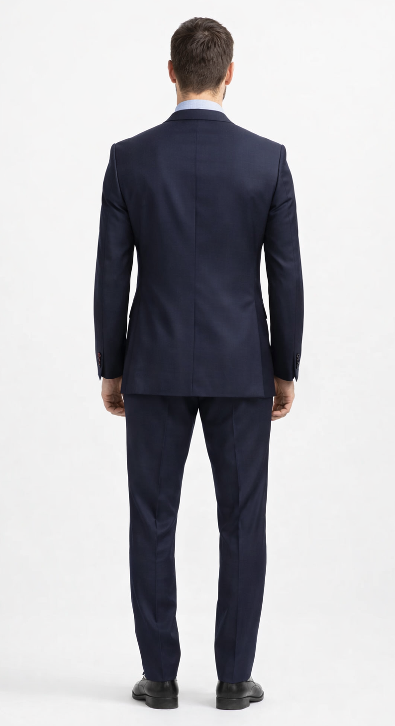 Carlo Lusso navy two-button suit: Tailored fit, single vent. Durable poly blend with subtle texture. Solid navy color, includes matching trousers.