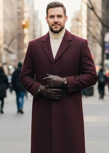 Burgundy men's single-breasted topcoat with a tailored, straight cut silhouette. Smooth, solid fabric, notched lapel, button closure, and side pockets. Mid-calf length, classic style.