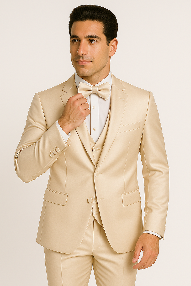 Formal four-piece tuxedo set in champagne. Includes jacket, vest, pants, and bow tie. Features a tailored jacket with notched lapels, a fitted vest, and straight-leg pants. Crafted from smooth, lustrous fabric.