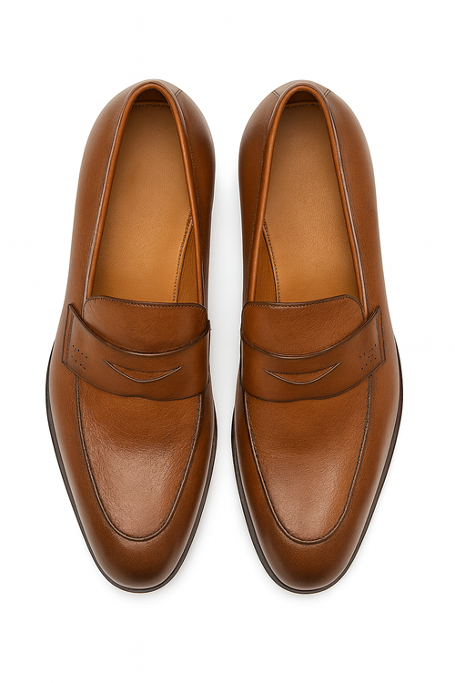Mezlan Fabrizi penny loafer: Cognac calfskin, elongated shape, rounded toe. Classic penny slot, subtle stitching. Streamlined, slightly elevated outsole.