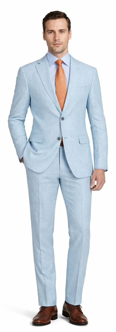 Light blue linen suit with fitted jacket, single-breasted closure, and matching trousers. Features a standard lapel and is styled with a contrasting orange tie.