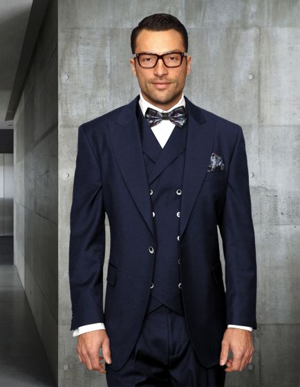 Navy blue men's urban suit in 100% wool. Single-button jacket, double-breasted vest (six buttons), and pleated pants. Features notched lapel, decorative pocket square. Structured design.