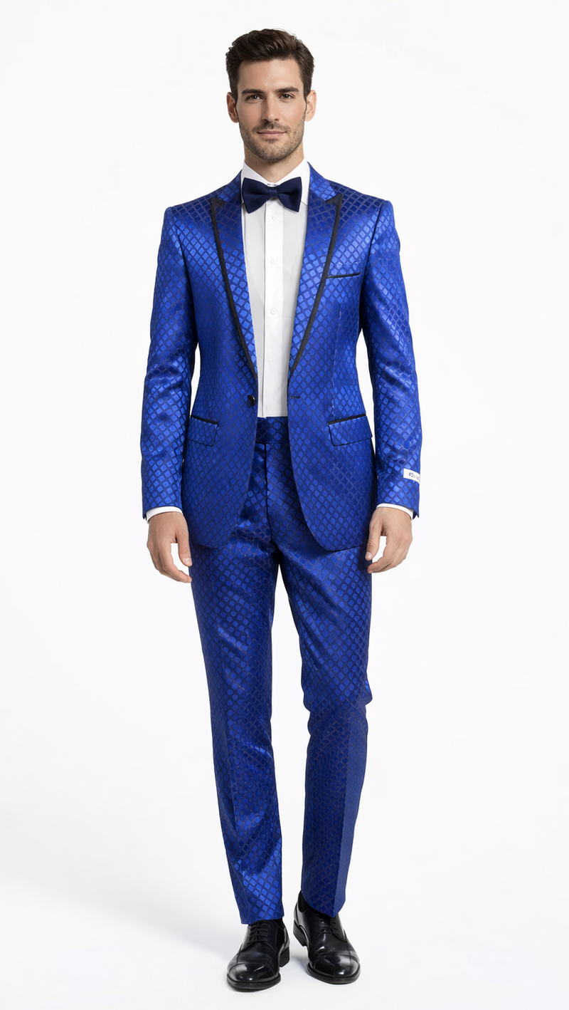 Navy checkered slim-fit tuxedo by Albertonardoni. Features a glossy fabric with black satin trim, peak lapel, and structured shoulders. Includes matching tailored trousers. Worn with a white shirt and bow tie.