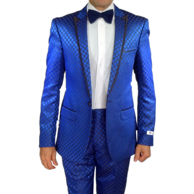 Navy checkered slim-fit tuxedo by Giovanni Testi. Geometric diamond pattern, varying blue shades, single-breasted, black lapels, satin-like sheen. Paired with white shirt & navy bow tie for formal wear.