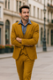 Gold men's suit with double-breasted vest, two-button peak lapel, and straight-cut trousers. Tailored fit, matte finish.