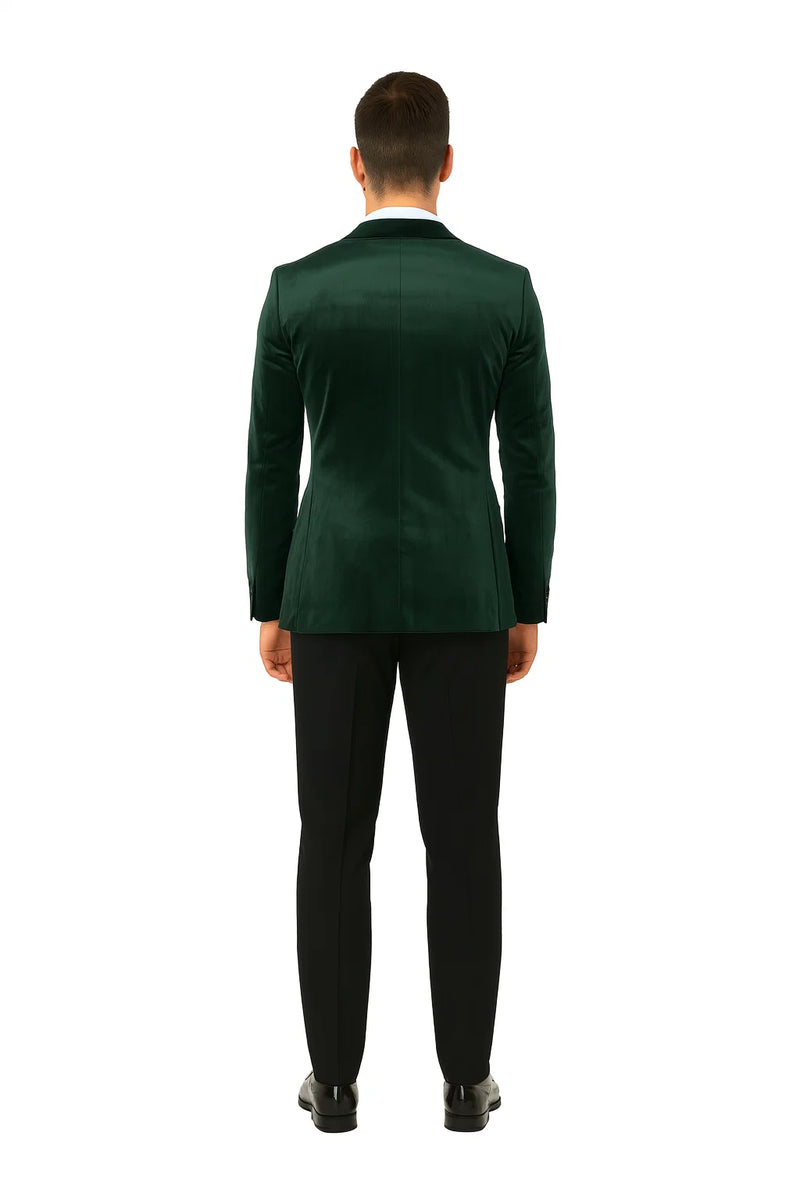 Green velvet double-breasted tuxedo jacket. Tailored fit, structured shoulders, smooth silhouette. Rich green velvet for a luxurious look. Peak lapel, classic design. Sleek, unembellished back for formality.