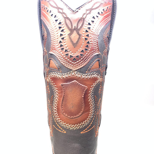 Brown Los Altos cowboy boots. Ostrich quill leather, intricate stitching, embossed patterns. Tall, pointed shape with decorative shaft, cutouts, contrasting colors.