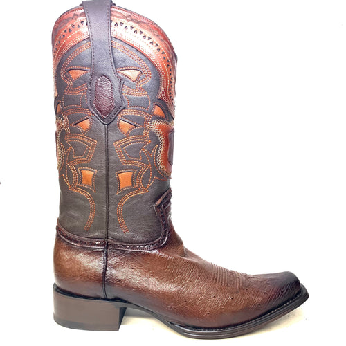 Los Altos brown ostrich quill cowboy boots. Tall shaft with embossed designs, pointed toe, and low block heel. Crafted from leather.