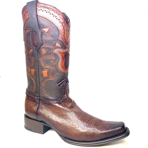 Brown Los Altos cowboy boots with smooth ostrich quill leather. Multicolored, patterned stitching on the shaft. Pointed toe, medium stacked heel. Seamless shaft-vamp transition.