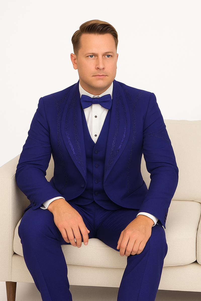Royal blue Italian wool tuxedo: modern fit, three-piece. Jacket with decorative stitching, matching vest, tailored trousers. White shirt, classic collar.