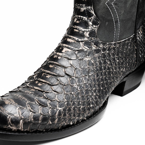 Marco Di Milano Kansas Lisba cowboy boots. Black textured upper with reptile skin look, round toe. Contrasting black shaft with white stitching. Stacked heel, smooth outsole.