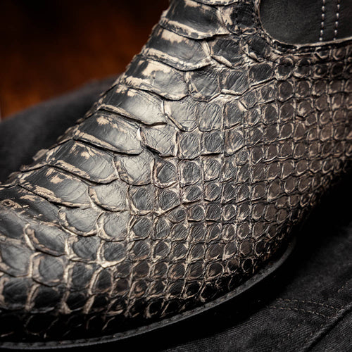 Textured black leather cowboy boots by Marco Di Milano. Kansas Lisba model features a round toe, reptilian skin-like texture, and detailed stitching.