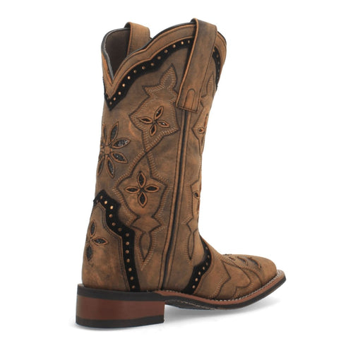 Laredo women's leather boots with a broad square toe and tall shaft. Honey-colored leather features floral/geometric embroidery and contrast stitching. Darker side strip with studs, slight heel.