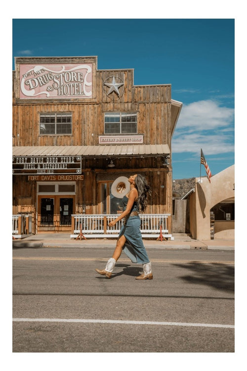 Laredo Kite Days women's boots. Light leather, broad square toe, decorative stitching, and above-ankle height. Slight heel.