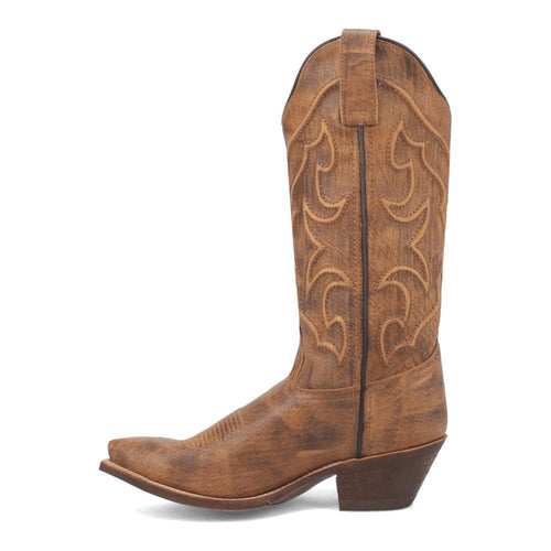 Laredo Reva snip toe boots in honey brown leather. Tall shaft with textured design and stitched patterns. Pointed toe, angled heel, pull tab.