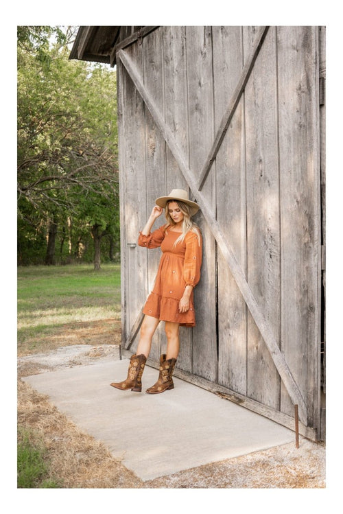 Brown Laredo Secret Garden women's boots. Square toe, decorative shaft pattern. Medium height, sturdy sole, visible stitching. Leather.